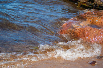 water flowing into the seashore