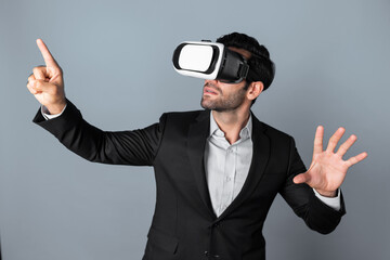 Skilled business man looking at data analysis while wearing VR glasses and suit. Project manager...