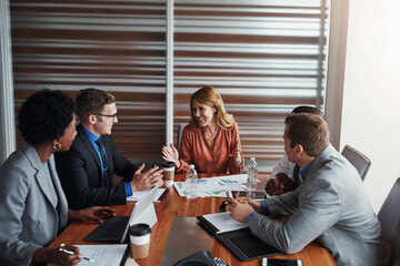 Business people, group and meeting with documents, data analytics and report for finance, accountant or stats solution. Analyst, leader or team talking or planning of graphs, charts or online results