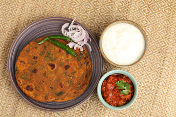 Methi or Fenugreek paratha or methi thepla with tomato chutney a Maharashtrian and Gujarati breakfast