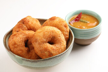 Medu vada with sambhar, a popular Indian breakfast or snack made from fermented urad daal and sambhar is made from toor dal and moong dal with vegetables