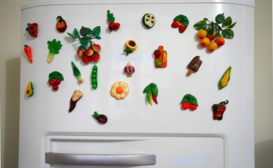 Healthy food magnets on refrigerator.