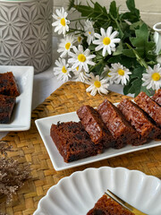 Kek Buah Kukus, a traditional Malaysian steamed fruit cake filled with dried fruits, nuts, and spices, enjoyed during celebrations.