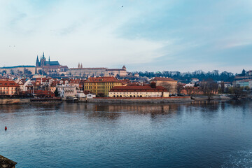 View of the city of Prague and the Vltava river with Old Town Bridge Tower on  Charles bridge  in Prague, Czech Republic.