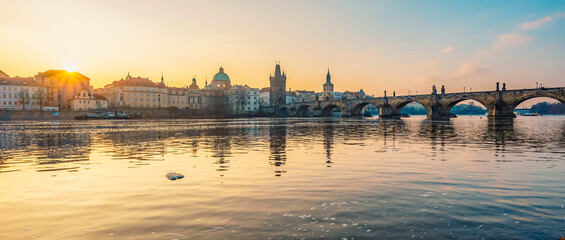 View of the city of Prague. Vltava river with Old Town Bridge Tower on  Charles bridge  in Prague, Czech Republic.