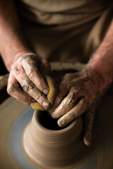 hands of a potter at work