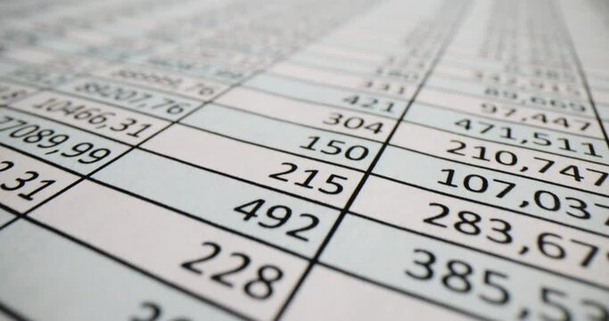 Paper sheet with digits columns on auditor workplace