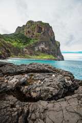 Naklejka premium Madeira island nature scenery. View of Porto da Cruz village mountains landscape and ocean pool.