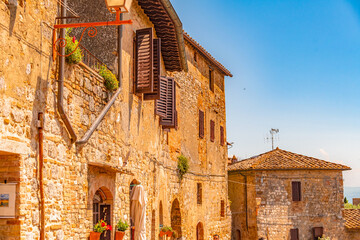 Medieval San Gimignano hill town with skyline of medieval towers, including the stone Torre Grossa. Province of Siena, Tuscany, Italy.