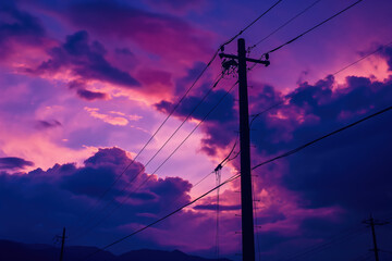 Power lines silhouette cutting through vibrant purple sunset sky