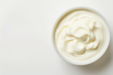 White bowl filled with creamy delicious mayonnaise on white background