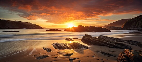 Sunset at Guethary beach in Lapurdi province in the French Basque Country, within the Department of Pyrenees-Atlantiques, showcasing a beautiful coastal scenery with copy space image.