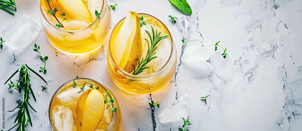 Fototapete fresh cocktail with pear, ice and herbs on the table. refreshing drink on a hot summer day. ice tea.