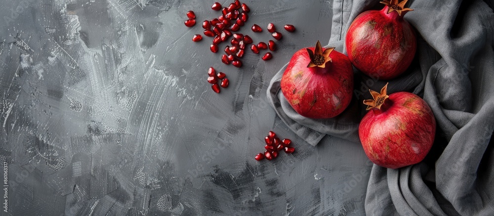 Poster gray textile with pomegranate fruit. with copy space image. Place for adding text or design