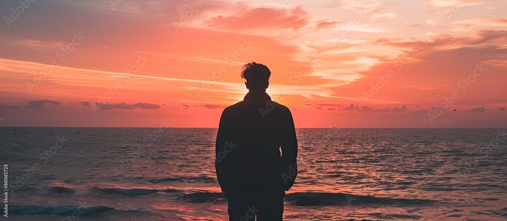 Aufkleber silhouette of human in the distance against the background of the sky and the sea at sunset. copy sp