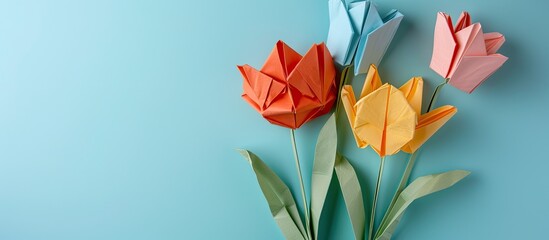 Origami tulip over pastel background  Flower  Design. with copy space image. Place for adding text or design