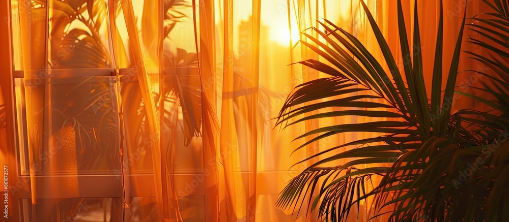 Aufkleber romantic curtain inside a home with palm leaf and a orange sunset. with copy space image. place for 