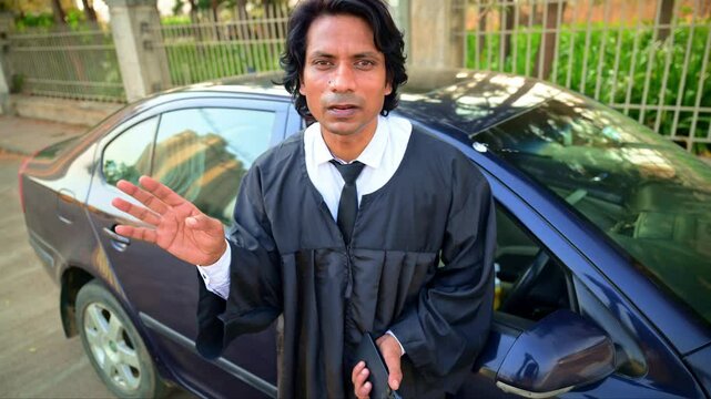 Lawyer talking while standing next to a car