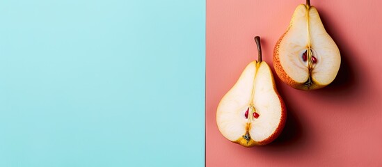 Whole and cut pears on a pastel background Pear   Food. Copy space image. Place for adding text and design