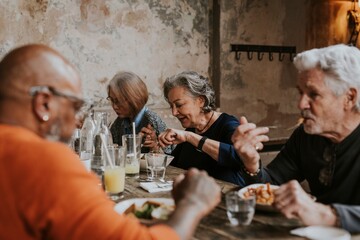 Old friends eating dinner at restaurant
