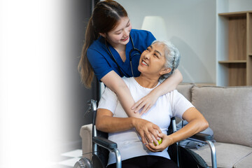 Obraz premium young caregiver assists her elderly woman patient at a nursing home. senior woman is assisted by a nurse at home.
