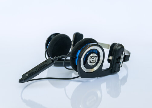 The Koss Porta Pro Wireless headphones in an unfolded position on a white background with reflection