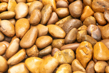 Round stones in the wall as an abstract background. Texture
