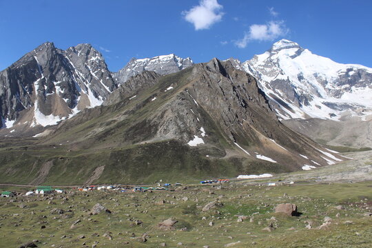 high peaks of snow filled mountain surrounding adi kailash mountain 