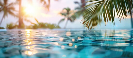 Summer pool background. Empty space on the pool edge, marble stone tiles and blurred swimming pool in tropical resort, summer background for display or montage your products. Copy space image