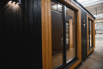 A new wooden modular prefabricated house inside in manufacturing facility