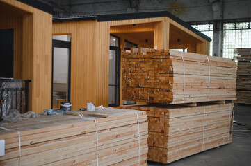 Newly built single storey prefabricated modular building. Prefabricated mobile wooden house at construction site