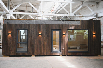 A new wooden modular prefabricated house inside in manufacturing facility