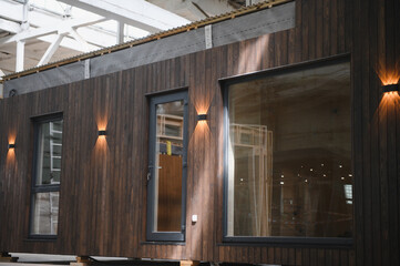 A new wooden modular prefabricated house inside in manufacturing facility