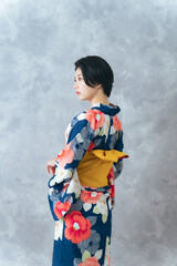 Fototapeta premium Portrait of young Asian woman wearing Yukata(Japanese traditional summer kimono clothes).
