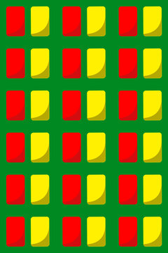 Side by side yellow and red sports penalty cards against green background