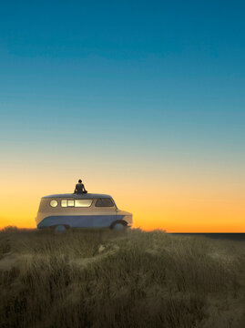 Illustration of man sitting on top of camper van at sunrise