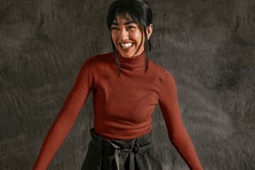 Happy woman in burgundy turtleneck sweater, autumn apparel fashion design