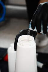 Effective cleaning with extractor and oxygen cleaner detergent. Cleaner is using oxygen cleaner liquid to wash off upholstered furniture.