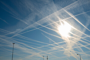 Large number of contrails visible in sky on summer day in Netherlands