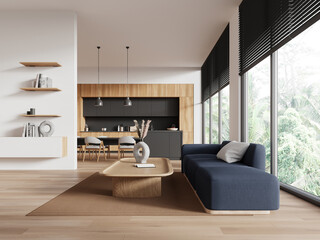 Modern flat studio interior with cooking and lounge zone with couch and window