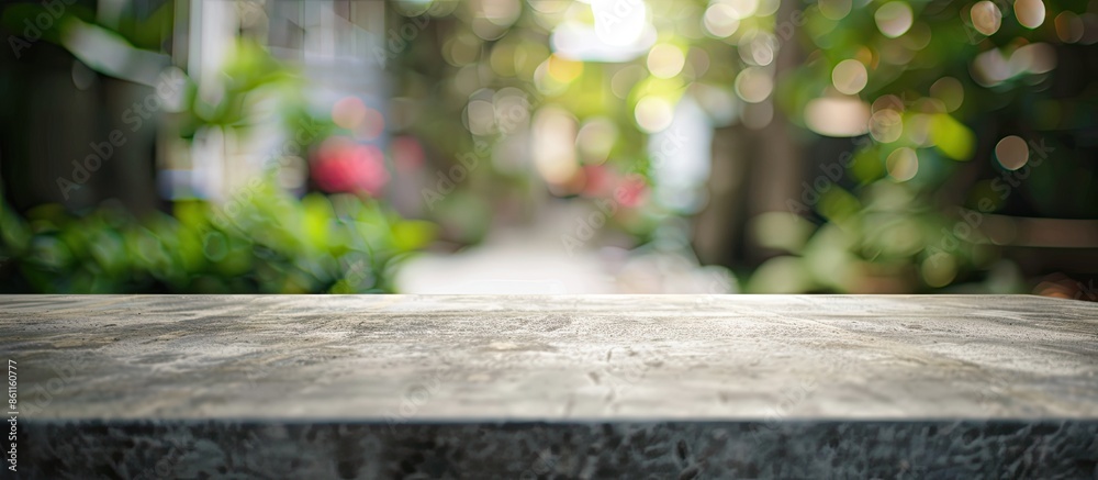 Wall mural Cement table top and blurred background. Copy space image. Place for adding text and design