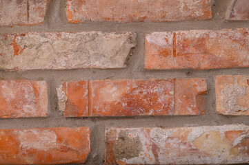 Mur z czerwonej cegły, ściana wnętrze budynku bez tynku 