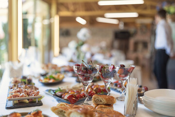 Wedding served banquet table with cold, hot appetizers. table with snacks, catering for a wedding....