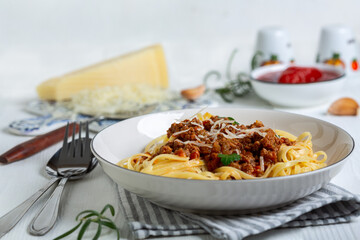 Fresh pasta with hearty bolognese and parmesan cheese.