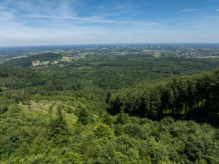 Fototapeta premium Summer green forest in Jaworze. Drone view in Beskid mountains. Beskid mountains in Jaworze. Drone fly above green mountains in summer. Polish green mountains and hills aerial drone video
