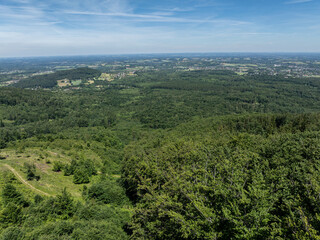 Fototapeta premium Drone fly above green mountains in summer. Polish green mountains and hills aerial drone photo. Drone view in Beskid mountains, Blatnia. Summer green forest on Blatnia. Beskid mountains in Jaworze.