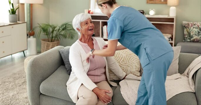 Senior woman, caregiver and help with clothes on sofa, ready and happy for conversation in morning. Nurse, carer and elderly patient with cardigan, support and talk on lounge couch in retirement home