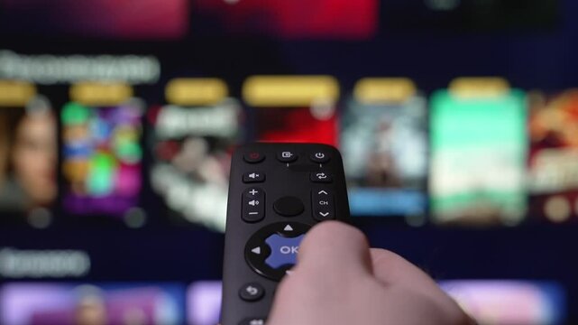 Streaming Television. Hand Holding TV Stick Surfing The Smart TV. Internet Online Cinema. Video on Demand