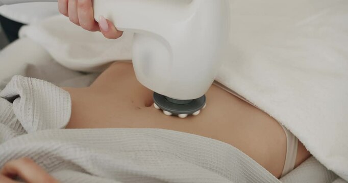 Close up Anti-cellulite machine cosmetology. Health and beauty, massage for reducing cellulite with electronic massage system for body. skin care, beauty treatment rejuvenation procedure.