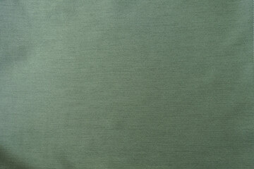 Background - reseda green polyester fabric with herringbone pattern